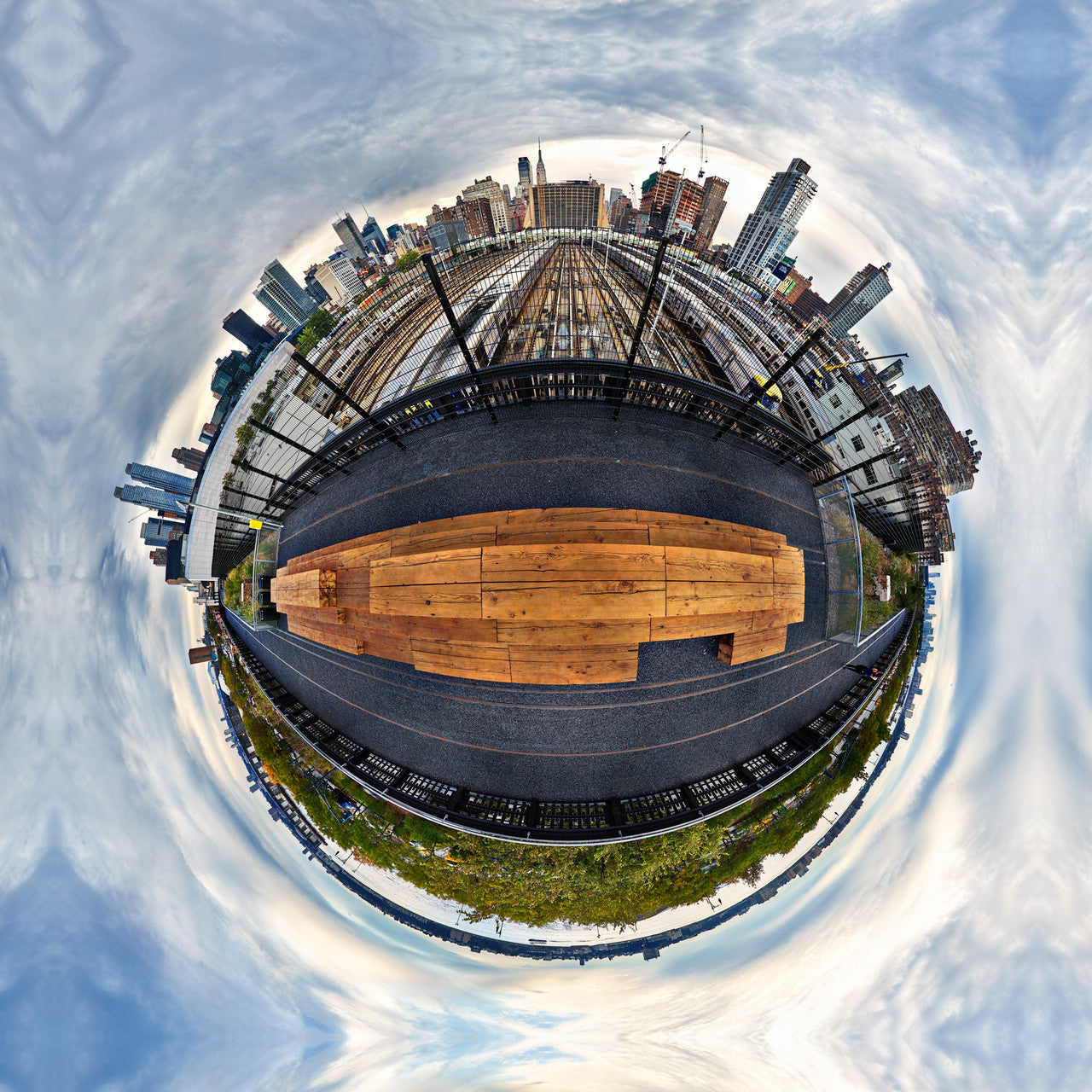 A 360-degree early morning panoramic image of the Highline Park in New York City with the wooden pathway contrasting against the city skyline, under a blue sky with soft sunrise hues.