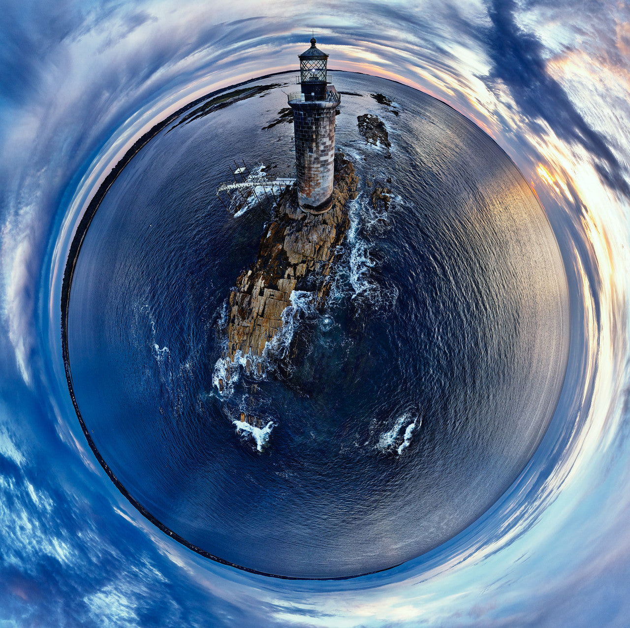 A 360-degree panoramic spherescape of Ram Island Ledge Light in Casco Bay at sunrise, featuring the lighthouse on a rocky outcrop surrounded by serene blue ocean and a pastel morning sky.