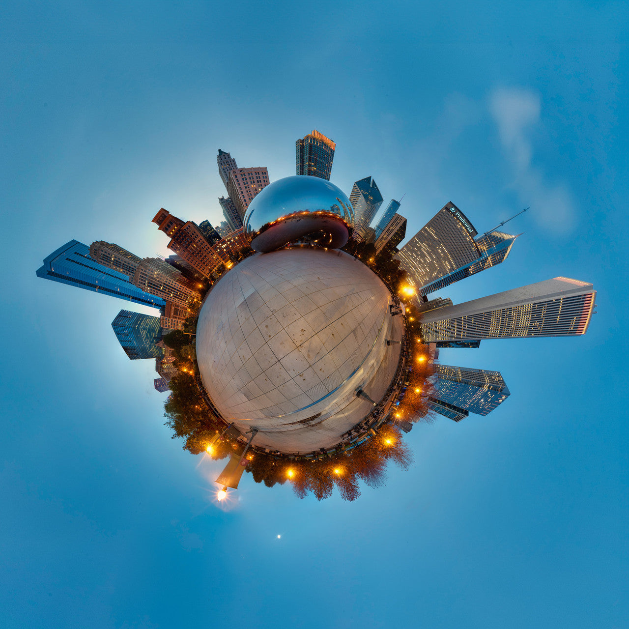 Spherical panoramic photograph of Chicago's Cloud Gate sculpture at twilight, surrounded by illuminated skyscrapers creating a perfect circular cityscape against a deep blue sky.
