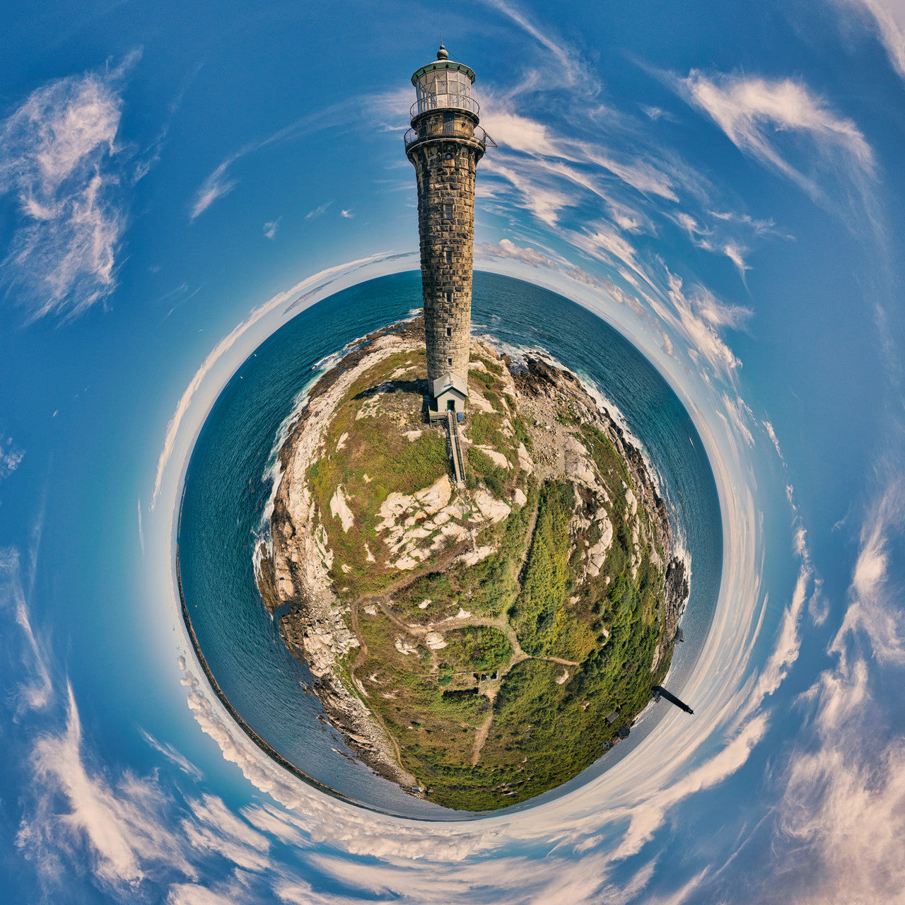 360-degree panoramic view of the Cape Ann Light Station in Rockport, Massachusetts, set against a blue sky in a spherical projection