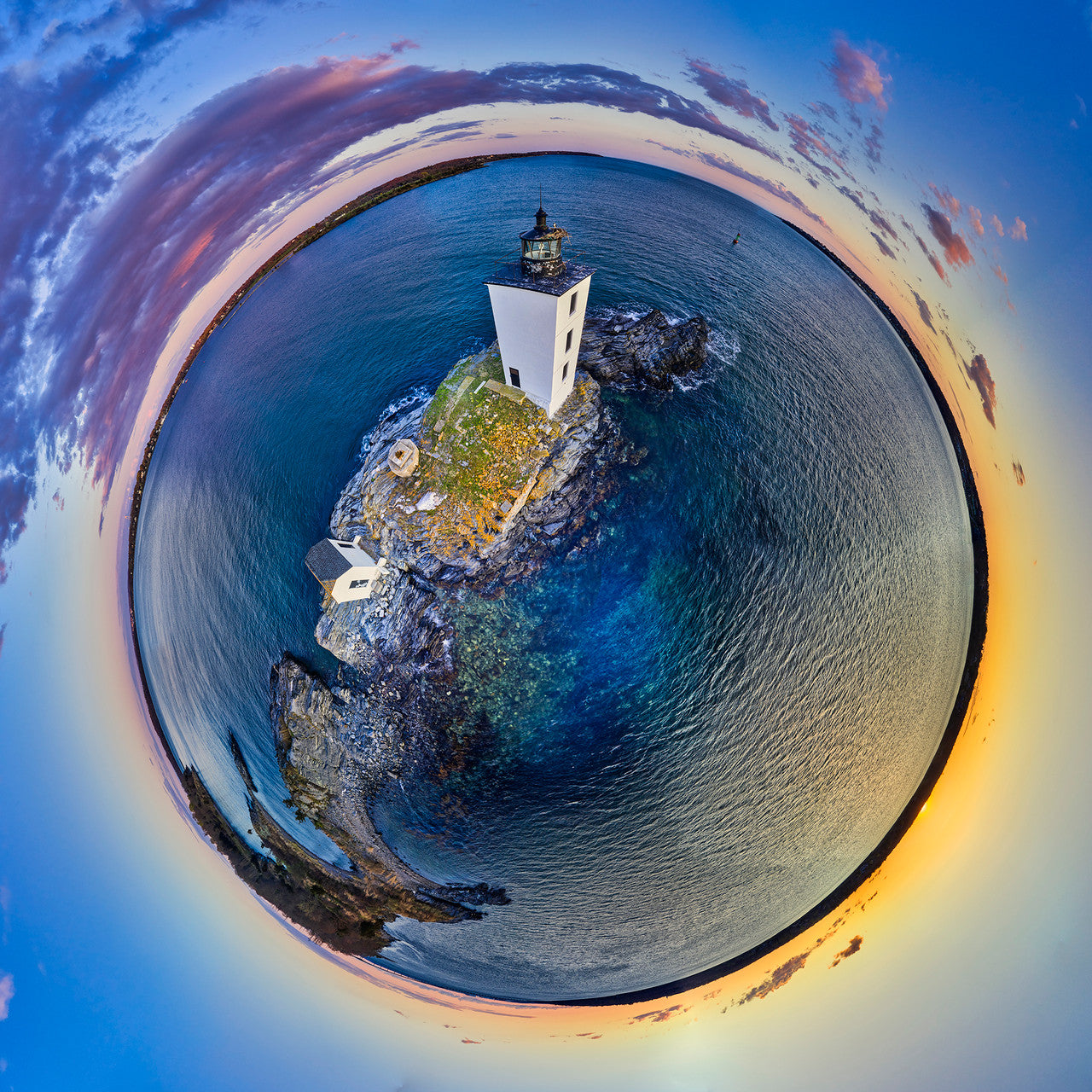360-degree panoramic spherescape of the Dutch Island Light off Jamestown, Rhode Island, at sunset. The lighthouse stands on a rocky island surrounded by vibrant azure and emerald waters, with a sky ablaze in hues of orange, purple, and blue.