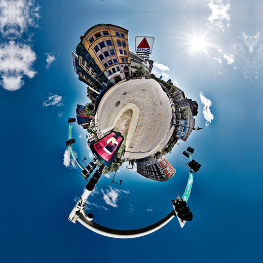 A 360-degree panoramic Spherescape featuring the Citgo Sign in Boston’s Kenmore Square, set against a bright blue sky with the urban surroundings wrapping around to form a spherical image.