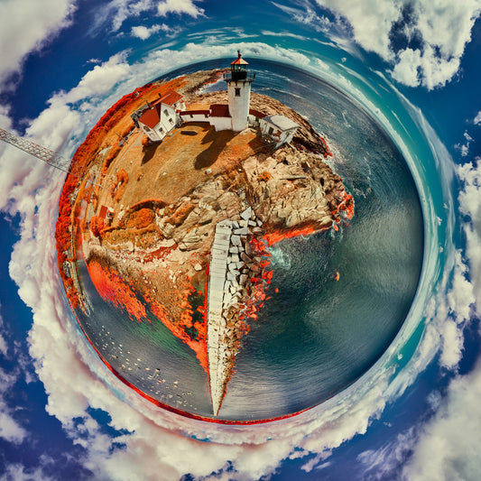 Color infrared panoramic image of Eastern Point Light Station in Rockport, Massachusetts, vividly rendered in a spherical projection with red foliage and blue skies