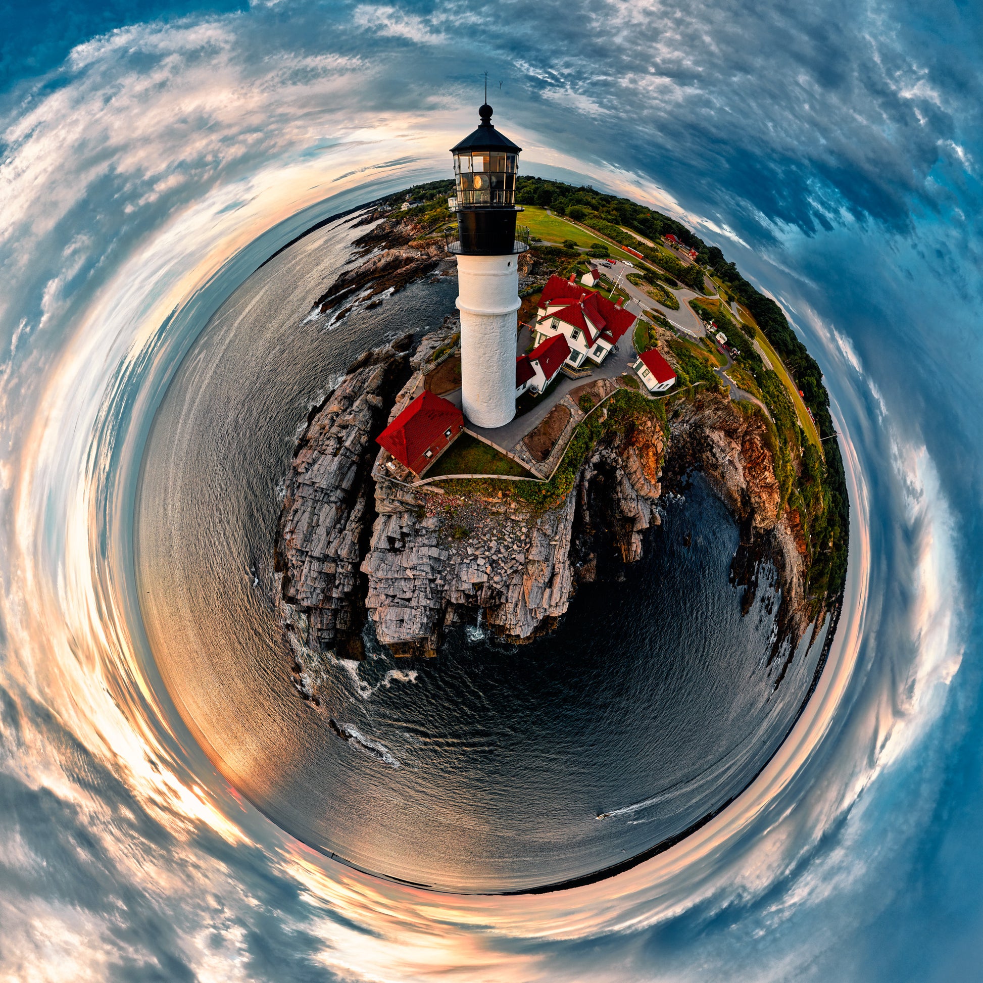 360-degree “tiny planet” image of Portland Head Light at sunrise, with the white lighthouse and red-roofed buildings perched on rugged cliffs surrounded by circular ocean and dramatic blue-orange sky.